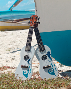 White ukulele with waves and whale shark design